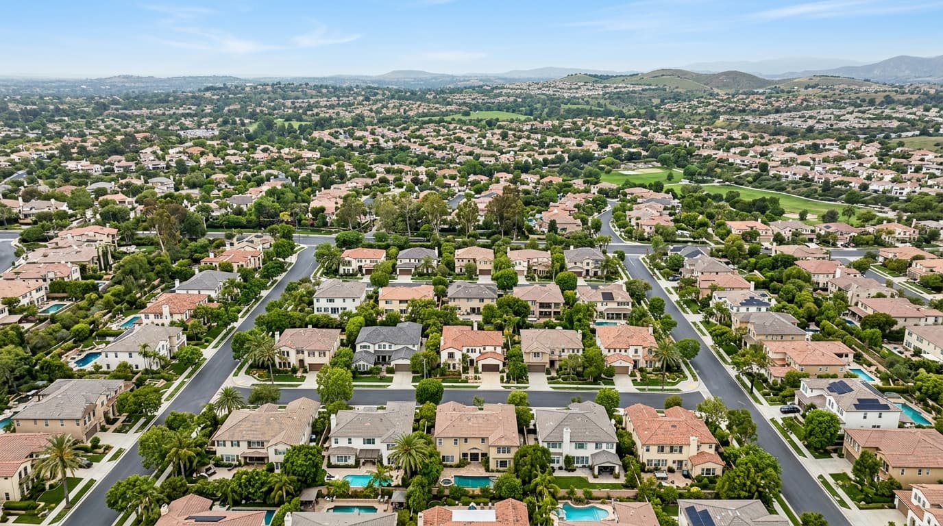 Aerial view of Orange County residential streets showing neighboring homes and tree-lined blocks